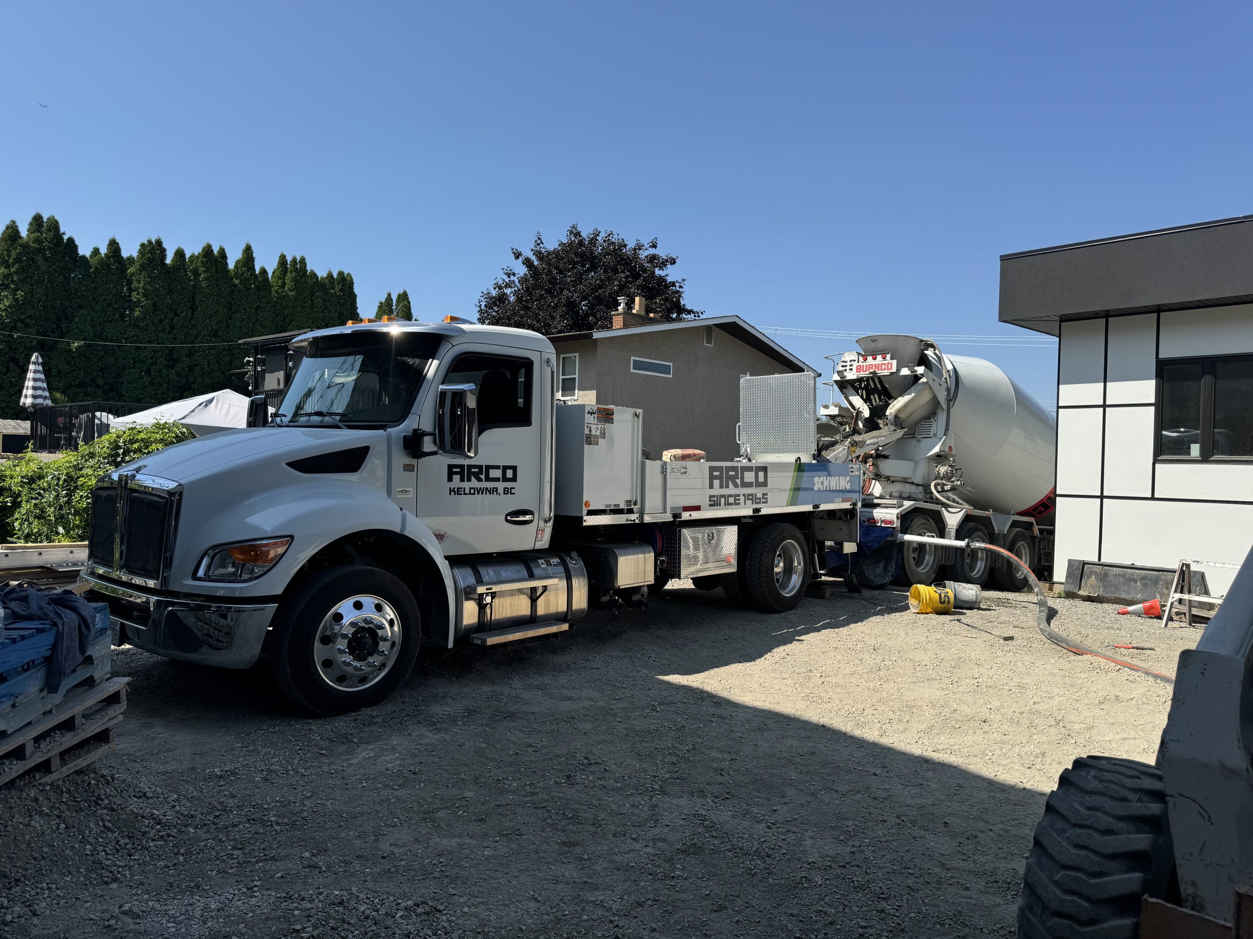 Arco Concrete Service | dropping off concrete next to house