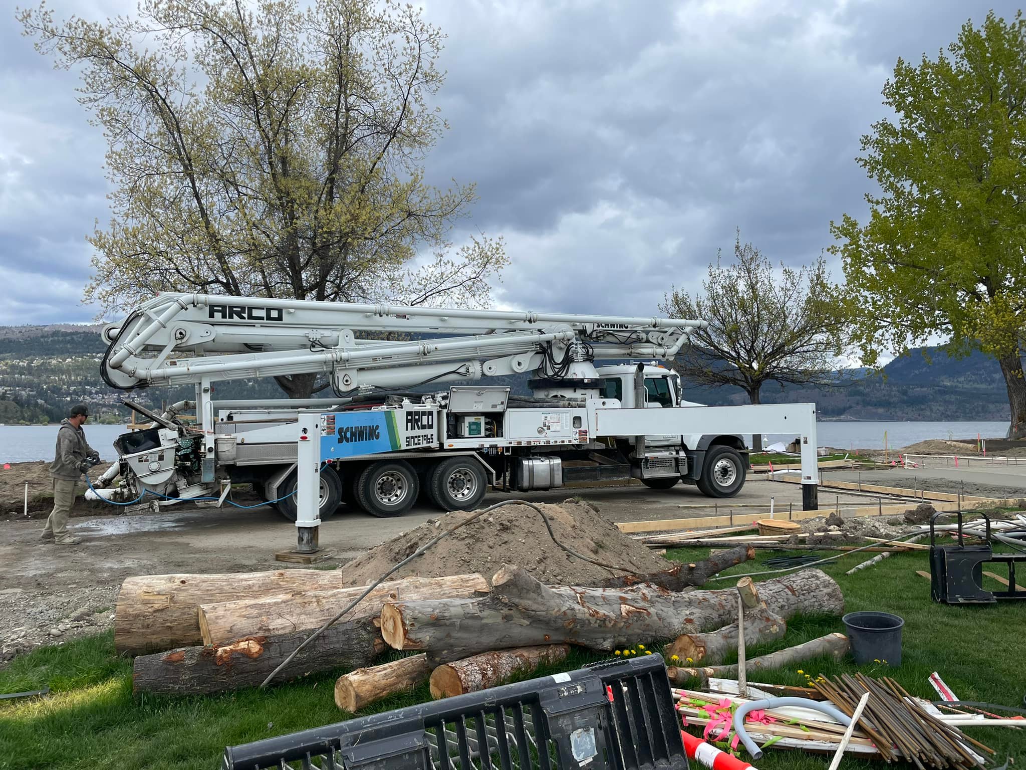 Arco Concrete Service | Arco Schwing truck before crane goes up by lake