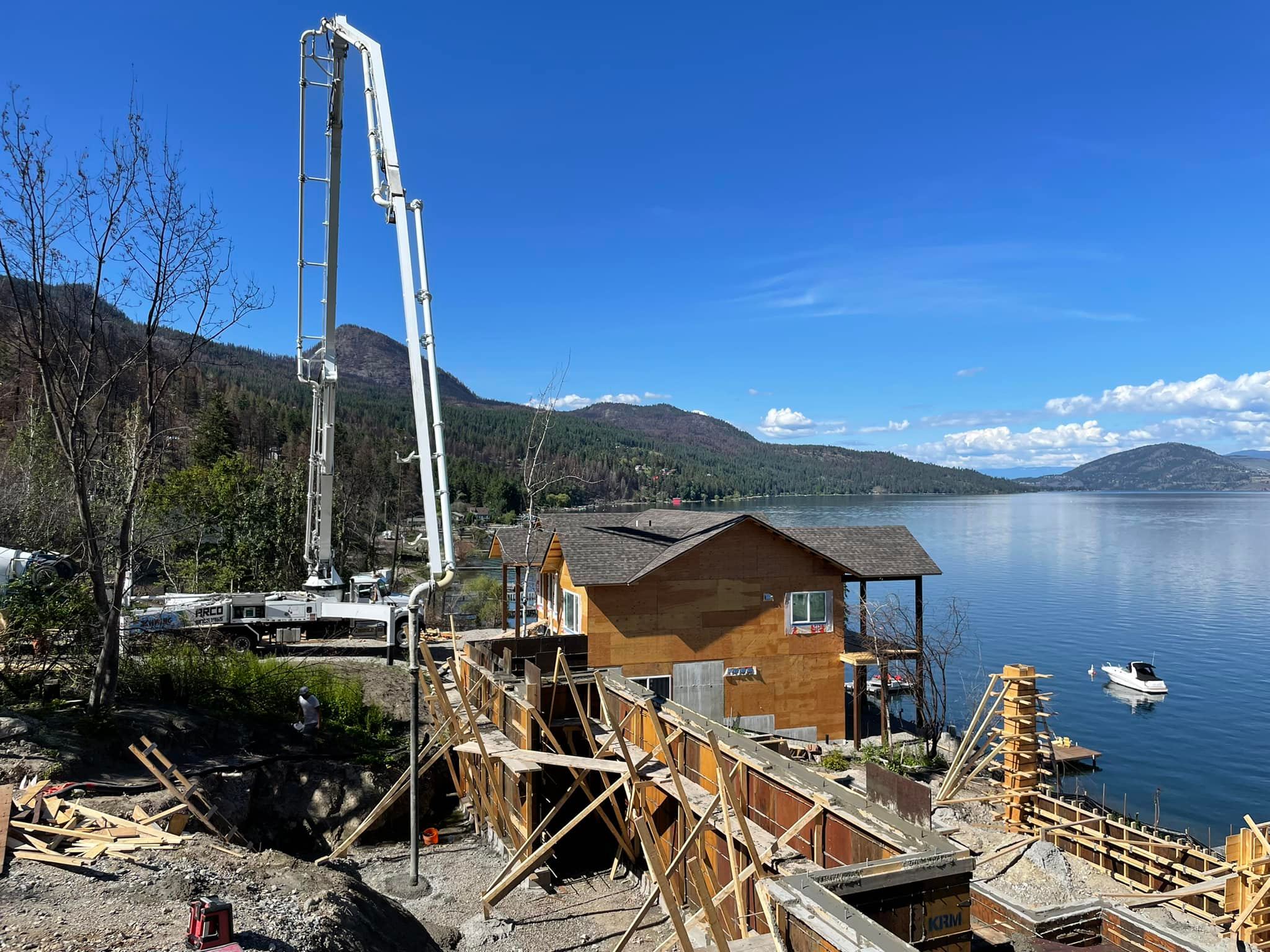 Arco Concrete Service | Arco pouring concrete for a new home by lake